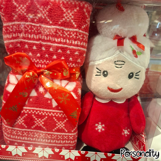 6671- Kerstset bestaande uit een knuffelpop en plaid. €22,95